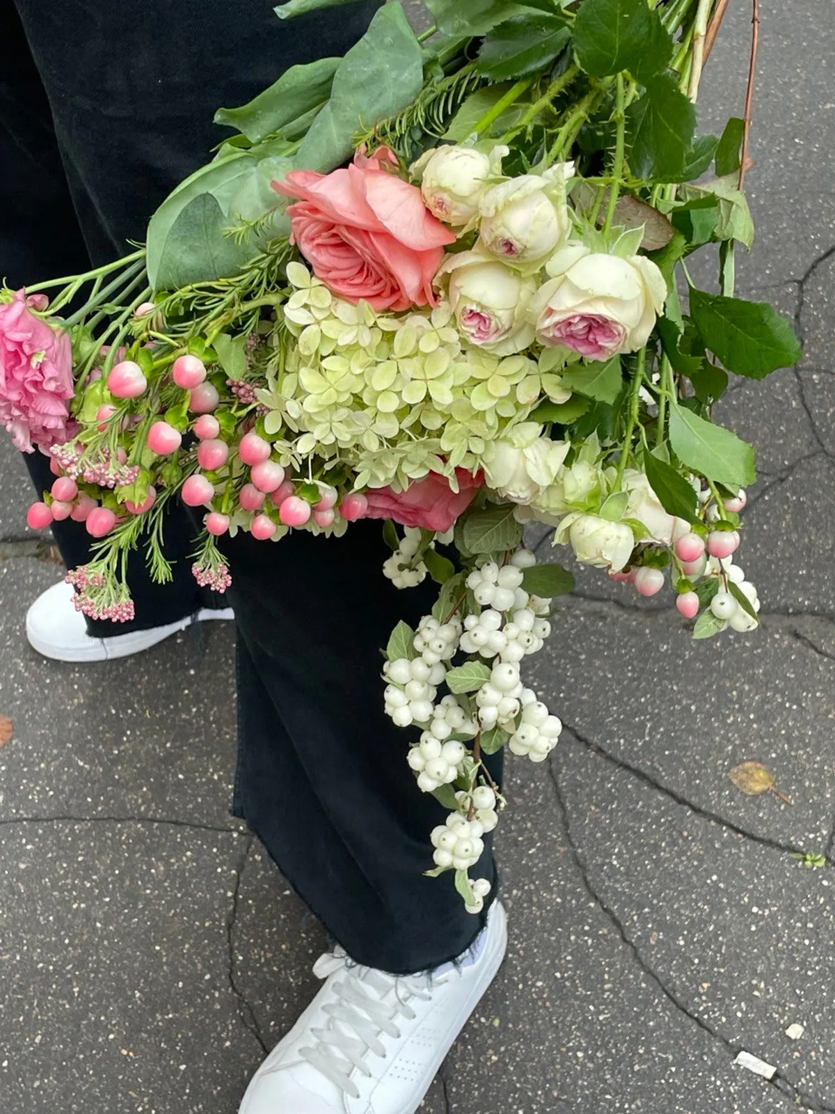 Fresh bunches of roses, peonies, chrysanthemums and daisies from the morning market